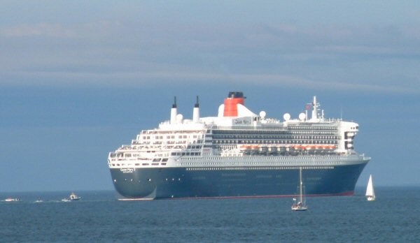 Leaving the Firth - the QM2 and the local Flotilla