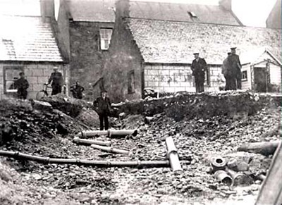 Flood damage in front of Oswald Lane