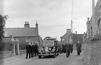 Funeral procession on High St.