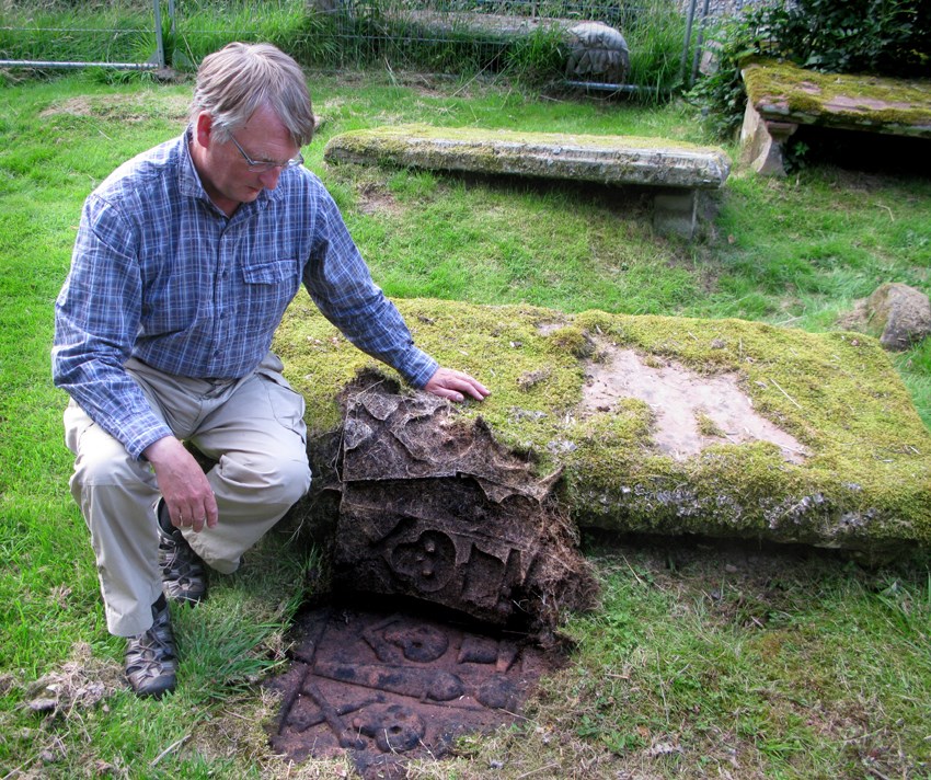 Revealing a gravestone at the East Church