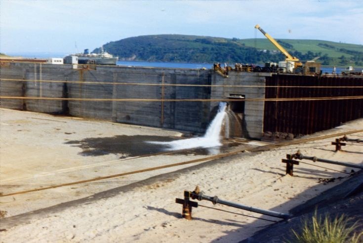 Sluices just opened, flooding the dock for the floatout of Highlahd Two 1974.