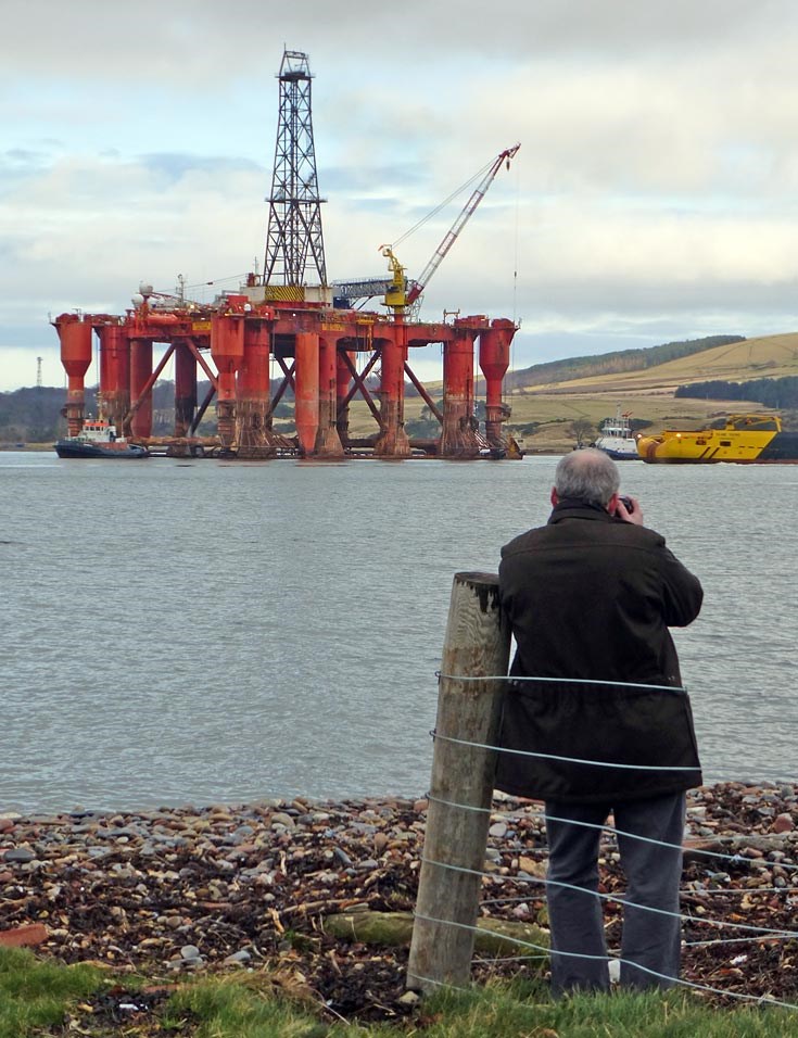 Calum Davidson taking photo of Borgsten Dolphin as it gets ready to leave the Cromarty Firth