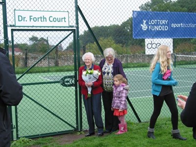 The official opening of the new tennis court on August 24th. Mrs Bain did the honours.
