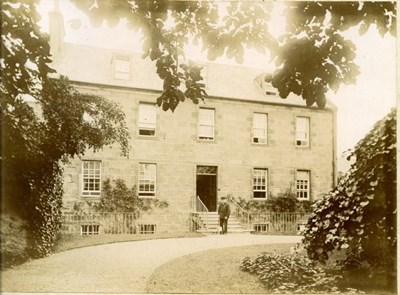 Rev. Walter Scott in front of Forsyth House