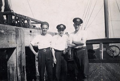 Men in a boat at the mouth of the harbour - c1951