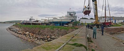 Yachts being winched into the harbour