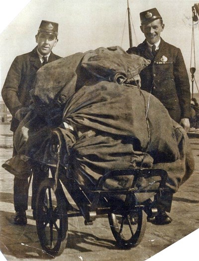 Picking up the mail from the ferry - c1933