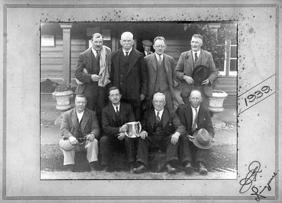 Men holding a Trophy