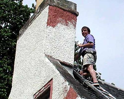 Gillian Newman painting her chimney